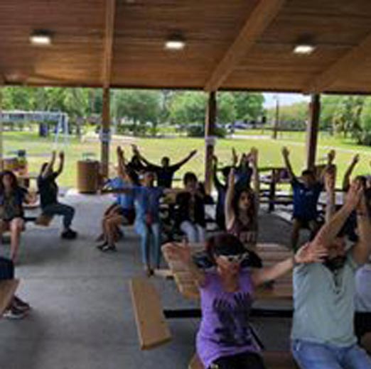 Aphasia family at the part doing a group physical activity