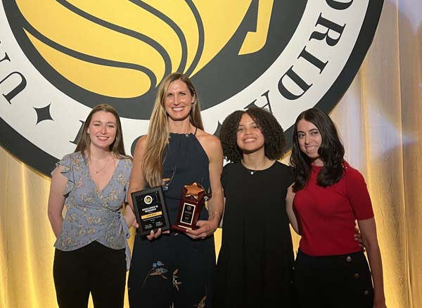 ARC Director and students accepting an award at UCF