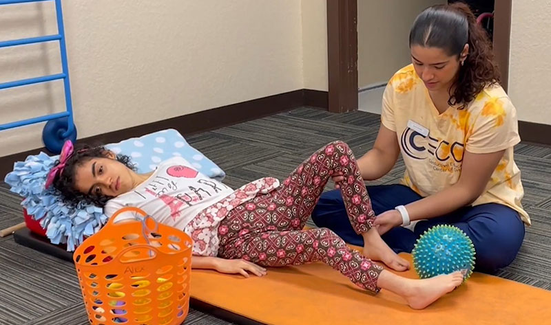 HS internship student helping child