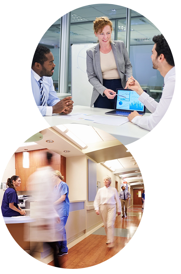 People looking at computer; Busy nurses station, people mostly blurred