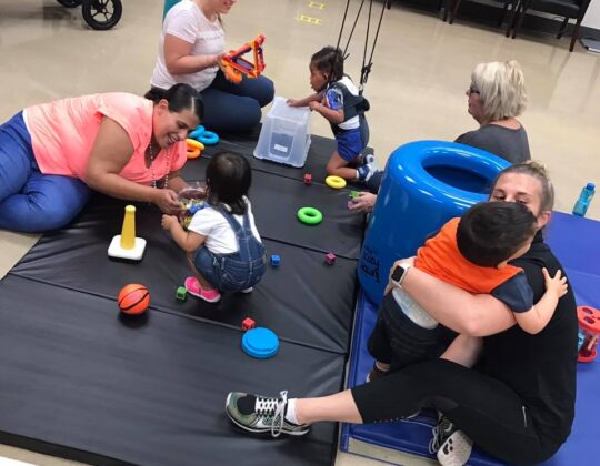 group photo of many children playing at the Innovative Mobility Initiative Lab