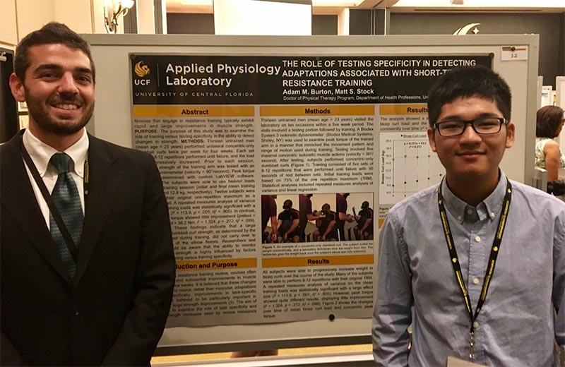 Adam Burton and David Phan in front of their poster presentation at the UCF Showcase of Undergraduate Research Excellence.