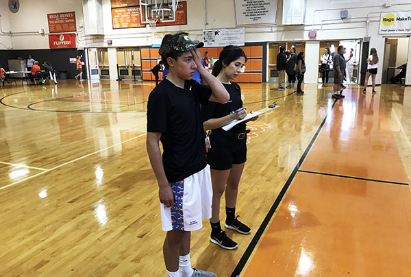 Michelle Bruno at Boone High School to perform a vision test on a high school student.