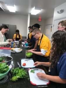 Students prepare taco bar.