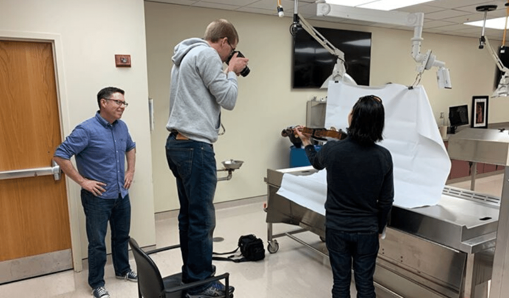 UCF Physical Therapy researchers working with a string musician