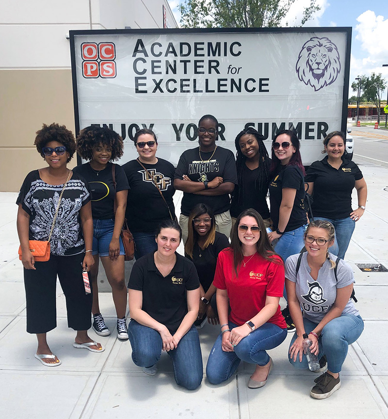Instructor Tiffany Lumpkin with her 2018 SOW4343-Macro Level Roles and Interventions students at the OCPS Academic Center for Success serving as volunteers at a back to school event.
