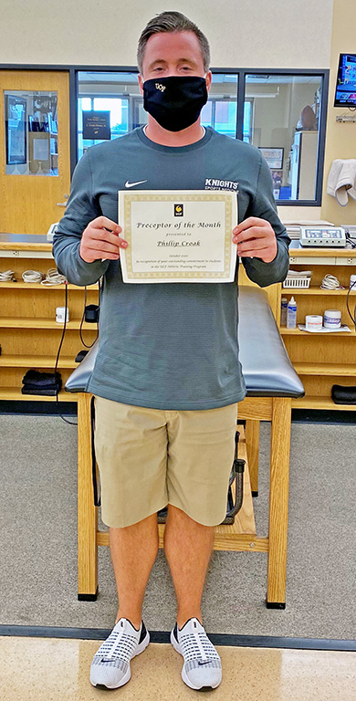 man holding certificate