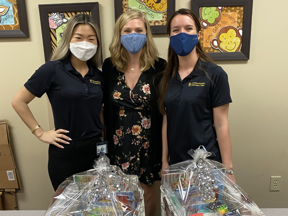 Whitney Haas (center) with graduate students Jeena Park (left) and Daniella Lopez (right).