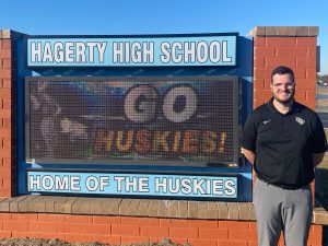 Ben Dilecce in front of Hagerty High School sigh.