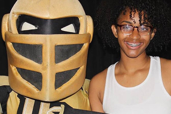 Knightro with a student.