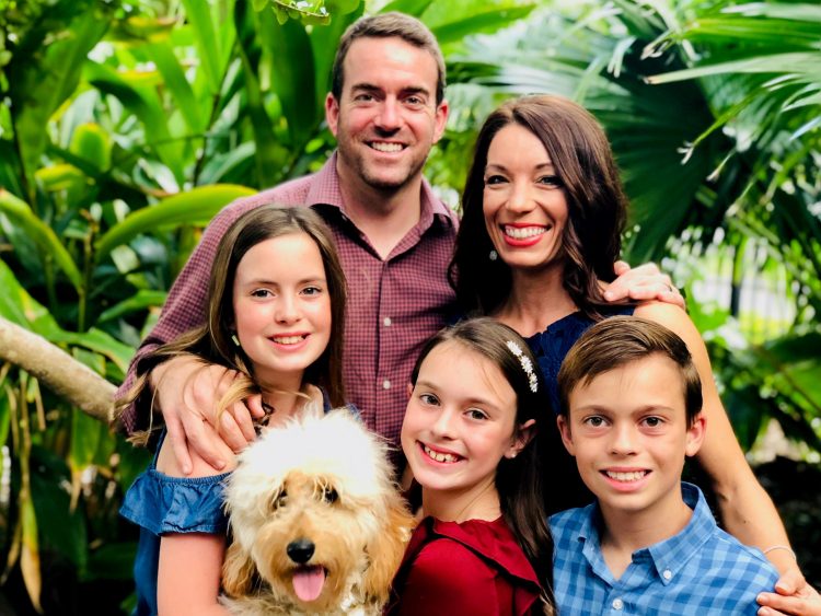 Erin Rolle with her husband, two daughters, son and dog.