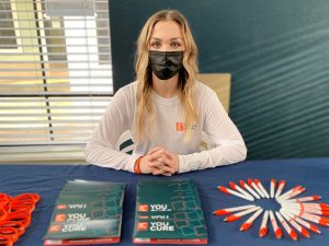 Sydney Horn wearing a mask while tabling.