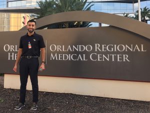 Uzair Hammad in front of Orlando Regional Medical Center sign.