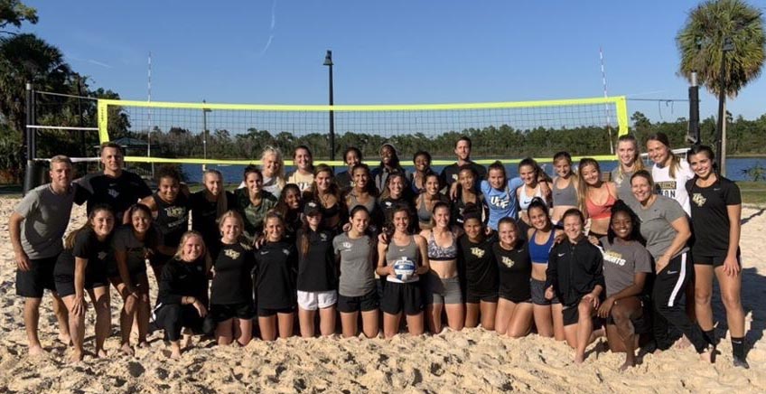 group of people on volleyball court, maxine furtado at left