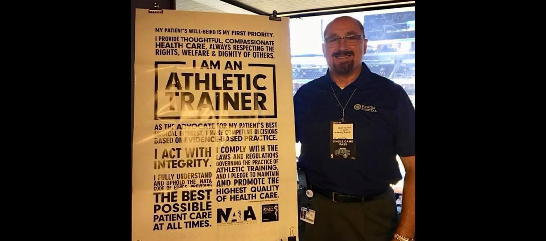 David Cassidy alongside an athletic training poster.