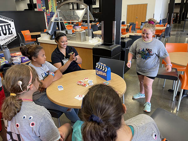 group of campers playing Guesstures