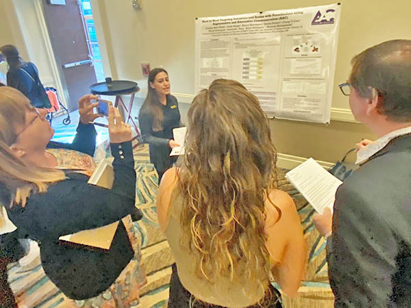 Researcher presenting research poster