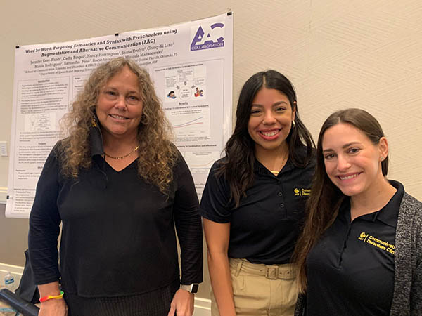 Nancy Harrington, Rocio Velasquez and Nicole Rodriguez with research poster