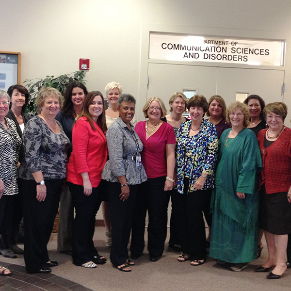 Rosa-Lugo with group of women as part of the UCF Consortium.