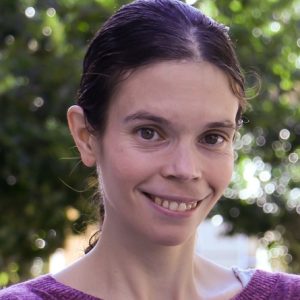 Headshot image of Assistant Professor Jeanette Garcia smiling at the camera.