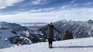 woman standing on snowy mountains