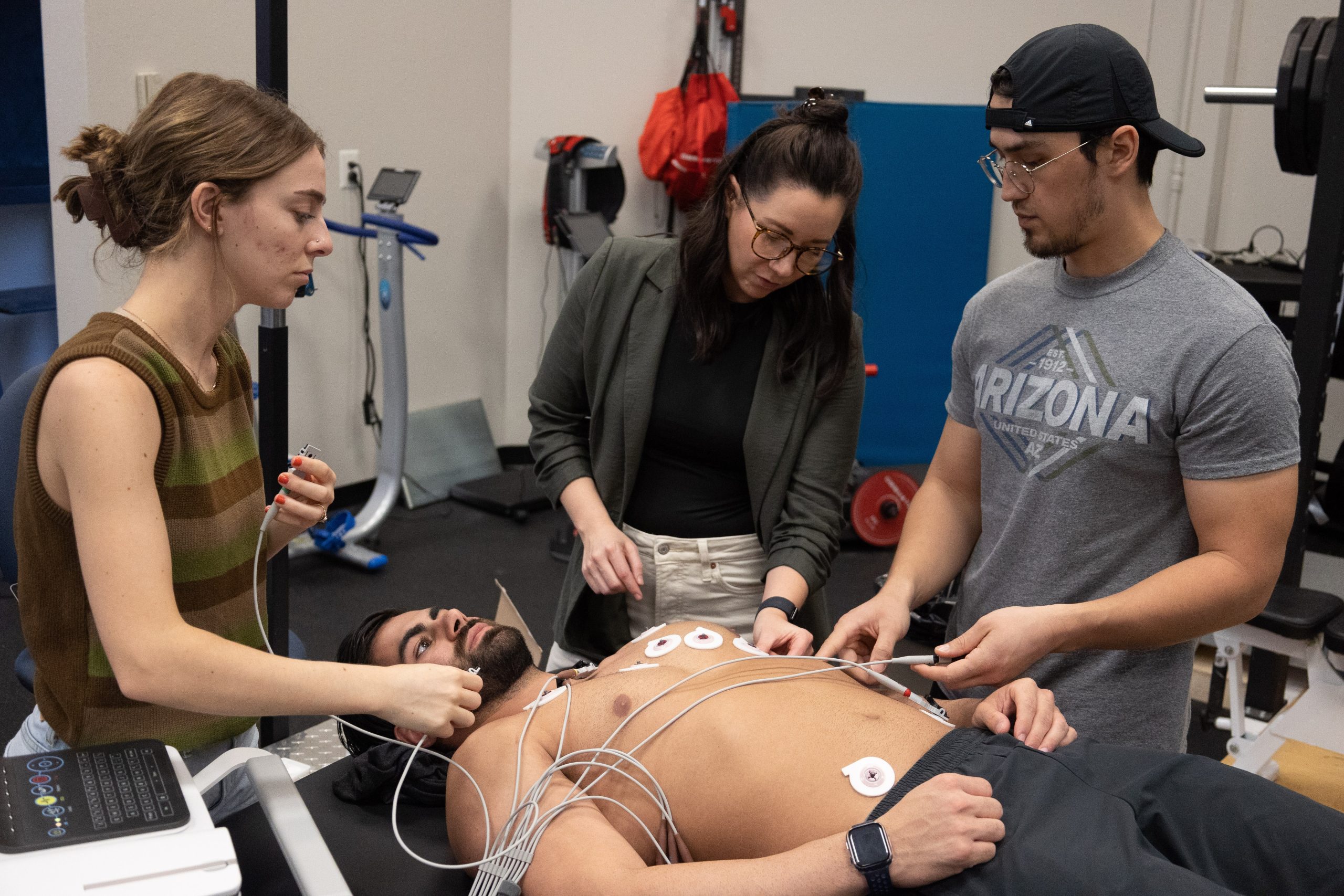 Graduate students in Fretti’s class on exercise cardiovascular physiology practice resting 12-lead electrocardiography assessments.
