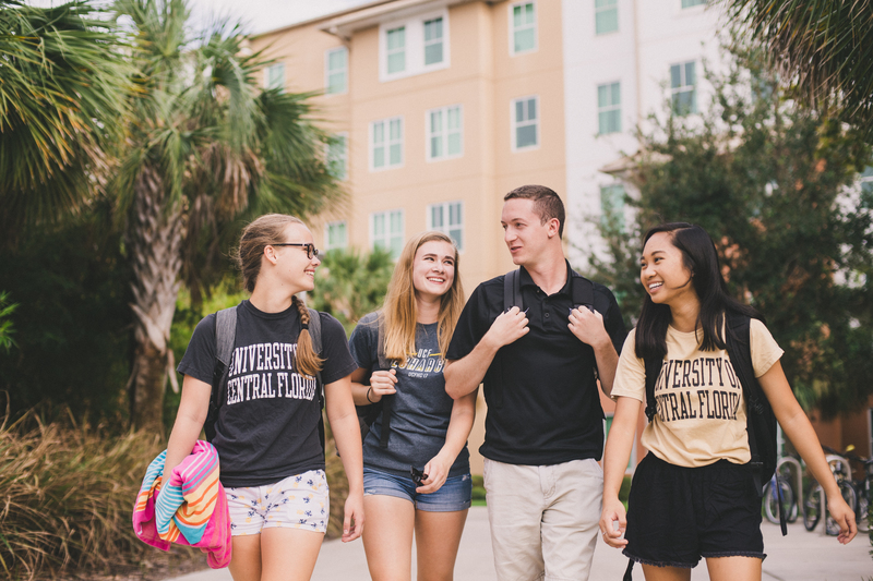 Four UCF students walking.