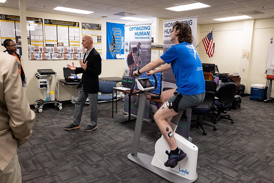 Representatives from Delsys demonstrate how electromyography can be used to study cycling performance during the IEPRS Lab Crawl.