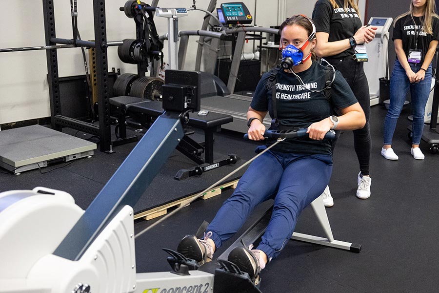 POWER Lab member Brandi Antonio performs a rowing test while metabolic data is collected.