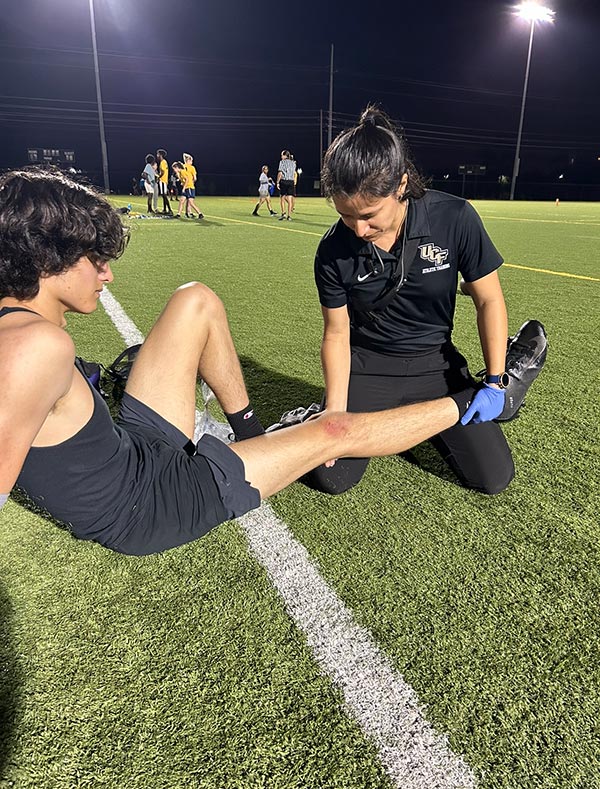 Sanchez-Torres evaluating a musculoskeletal injury during her clinical rotation at the Recreation and Wellness Center.
