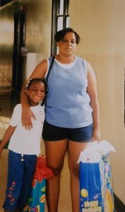 Angela Jarman as a child with her mother, a medical assistant, who helped inspire her interest in healthcare. 