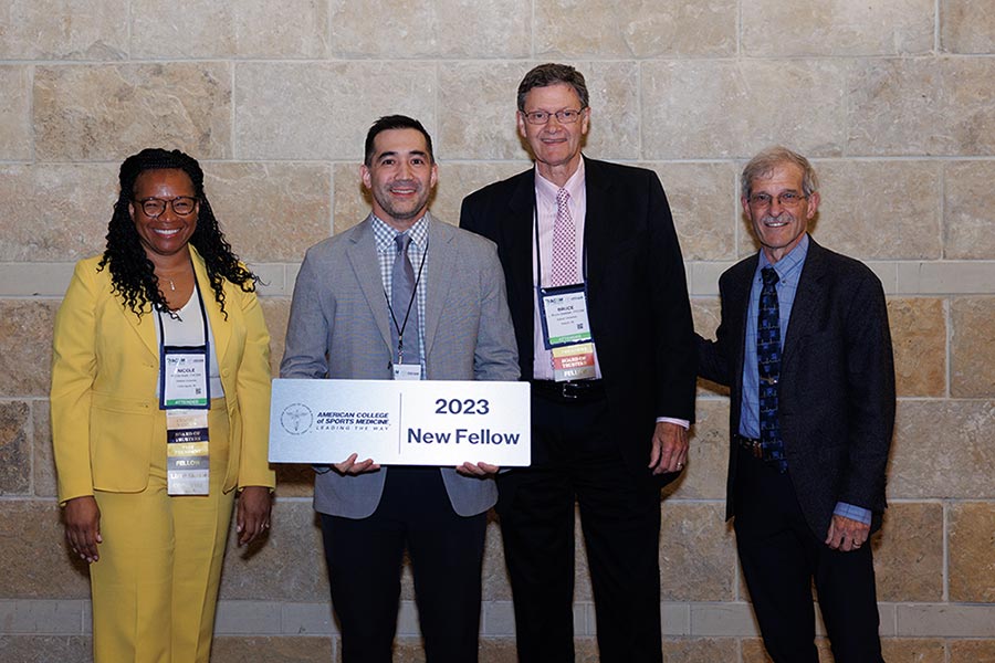 David Fukuda, professor and Division of Kinesiology chair, receiving Fellow Status from the ACSM with previous ACSM presidents NiCole Keith, Bruce Gladden and William Kraus.
