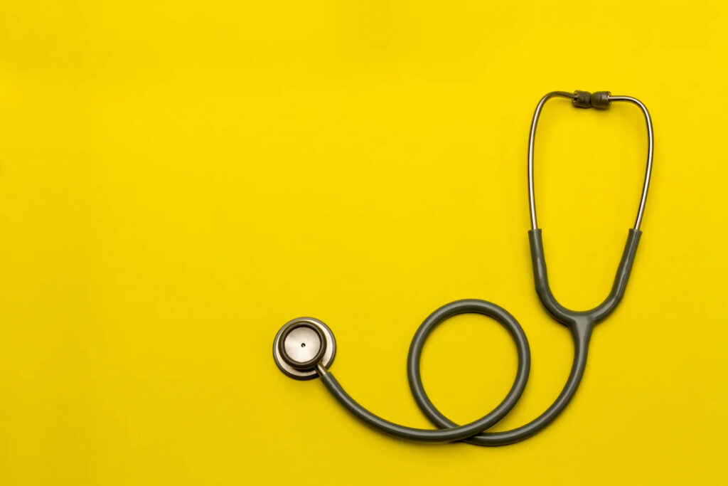 Stethoscope on gold background