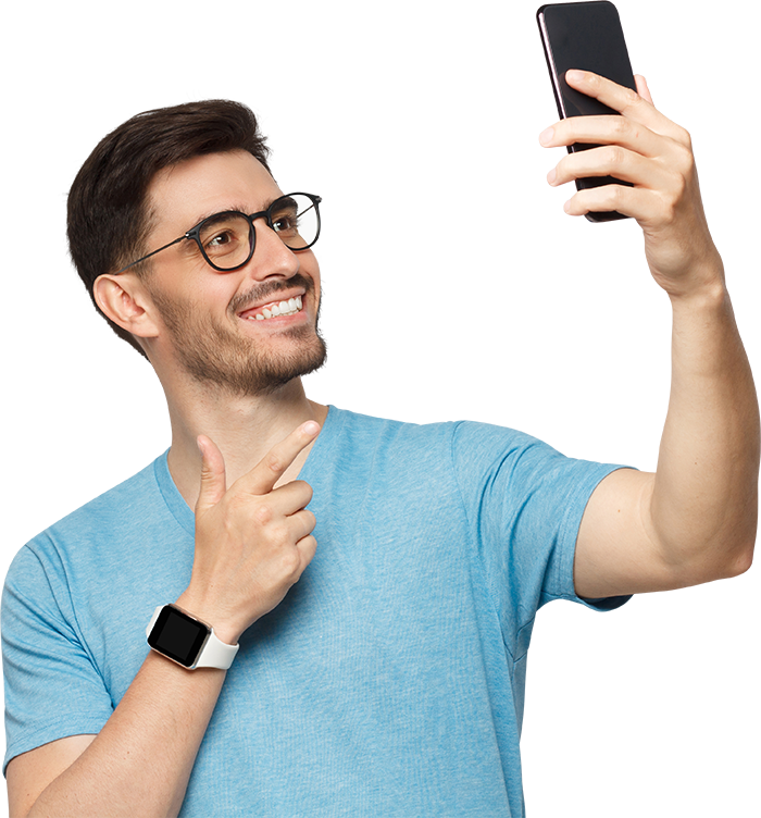 AdobeStock_1018324918 boy smiling with phone in hand