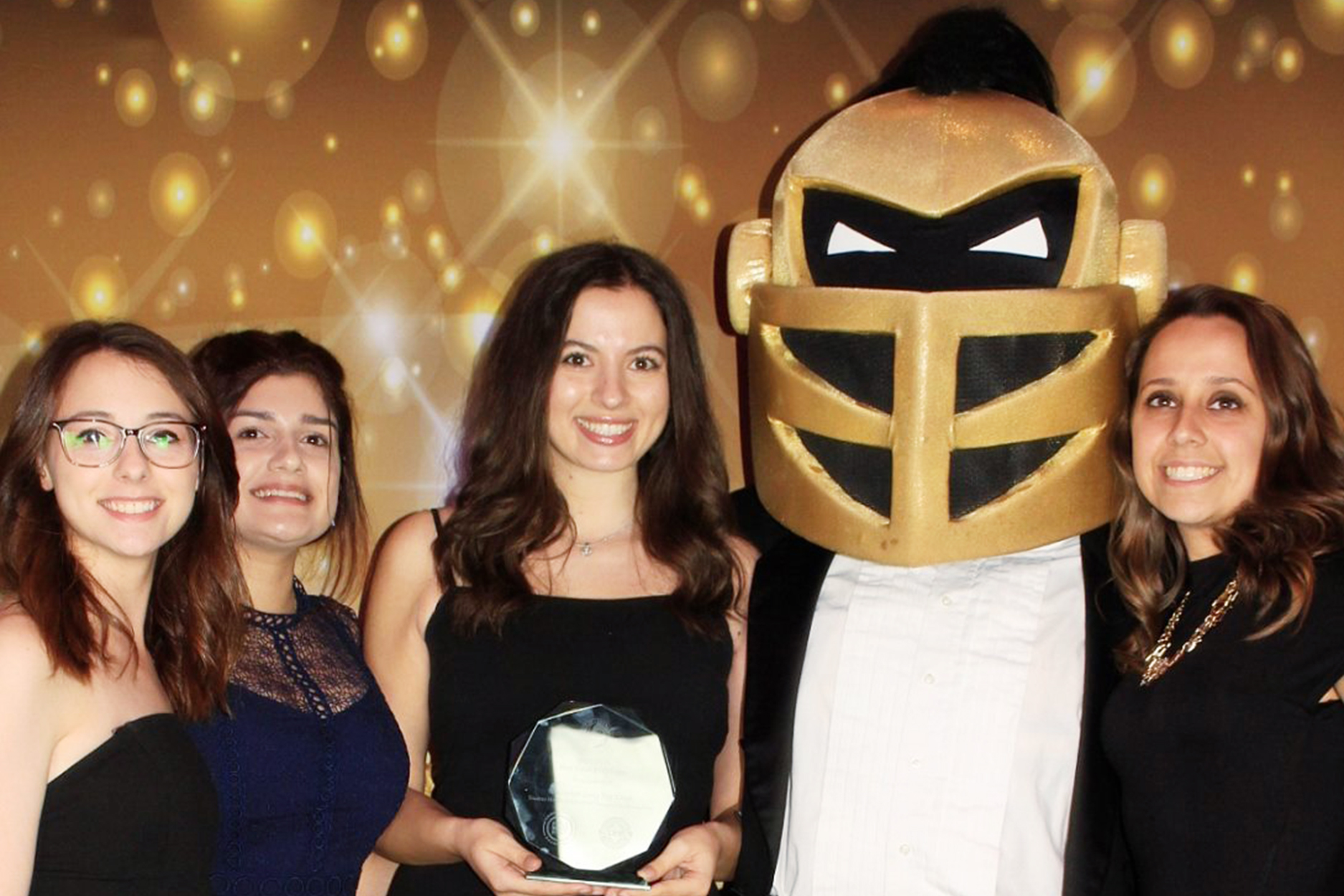 HMI Student Group Delivers Buckets of Halloween Candy to Children at Shelter, Wins Impact Award