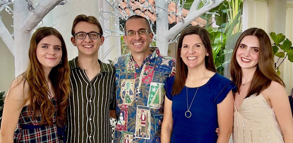 Dean Matthew Theriot (center) and his family from left to right: daughter Lucy, son Thomas, wife Emily, and daughter Grace.
