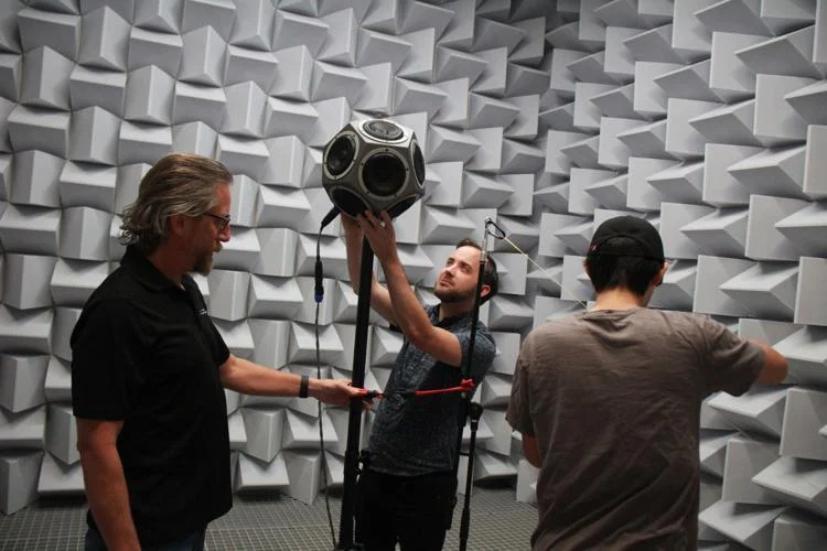 (Left to right) Dr. Pavel Zahorik, Dr. Matthew Neal and Joshua Yu, a graduate student studying computer engineering, put together a dodecahedron speaker and a measurement microphone inside UCF's brand-new anechoic chamber to measure the room's low-frequency cutoff on Wednesday. This room is an addition to UCF's Innovative Center.